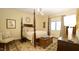 Comfortable bedroom showcasing a four-poster bed, area rug, and decorative chest at 2213 Weybridge Dr, Raleigh, NC 27615