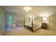 Comfortable bedroom with a four-poster bed, crib, and natural light at 2213 Weybridge Dr, Raleigh, NC 27615