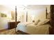 Bedroom featuring a luxurious bed, dresser, lamps and mirror at 2213 Weybridge Dr, Raleigh, NC 27615