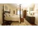Comfortable bedroom featuring a four-poster bed, wooden furniture, and warm lighting at 2213 Weybridge Dr, Raleigh, NC 27615