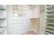 Organized walk-in closet with custom shelving and ample storage space at 2213 Weybridge Dr, Raleigh, NC 27615