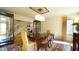 Elegant dining room with a stylish chandelier, hardwood floors, and seating for six at 2213 Weybridge Dr, Raleigh, NC 27615