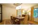 Elegant dining room with a crystal chandelier, large windows, and sophisticated decor perfect for formal gatherings and memorable meals at 2213 Weybridge Dr, Raleigh, NC 27615