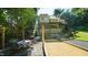 Exterior elevation showcases outdoor living area with string lights at 2213 Weybridge Dr, Raleigh, NC 27615