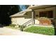 Charming home exterior with stone accents, a cozy porch, and beautifully maintained landscaping enhancing its curb appeal and character at 2213 Weybridge Dr, Raleigh, NC 27615