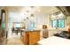 Open concept kitchen with island, stainless appliances, and view into dining area at 2213 Weybridge Dr, Raleigh, NC 27615
