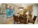 Bright kitchen with dining table and chairs, featuring large picture window at 2213 Weybridge Dr, Raleigh, NC 27615