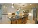 Elegant kitchen featuring a central island, stainless steel appliances, and ample cabinet space at 2213 Weybridge Dr, Raleigh, NC 27615