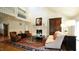 An elegant living room featuring a fireplace, rug, and wood floors at 2213 Weybridge Dr, Raleigh, NC 27615