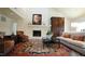 Living room boasts a stone fireplace, accent rug, and stylish furniture arrangement at 2213 Weybridge Dr, Raleigh, NC 27615