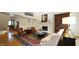 High-ceiling living room featuring a fireplace, comfortable seating, and hardwood floors at 2213 Weybridge Dr, Raleigh, NC 27615
