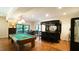 Spacious recreation area with a billiard table, wet bar, and sliding doors at 2213 Weybridge Dr, Raleigh, NC 27615