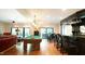 Entertaining space with billiard table, full bar, dining table, hardwood floors, and lots of light at 2213 Weybridge Dr, Raleigh, NC 27615