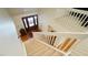 Carpeted staircase with wooden handrails leads to the home's entryway at 2213 Weybridge Dr, Raleigh, NC 27615