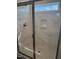 Modern walk-in shower featuring tiled walls, a glass door and a built-in niche at 23 Surles Landing Way, Benson, NC 27504