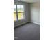 Bedroom with a window offering natural light and neutral carpeting at 23 Surles Landing Way, Benson, NC 27504