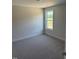 Bedroom with neutral-colored walls, and cozy carpeting at 23 Surles Landing Way, Benson, NC 27504