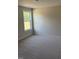 Bright bedroom featuring neutral carpeting and a window offering natural light at 23 Surles Landing Way, Benson, NC 27504