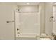 Well-lit bathroom features a tiled shower/tub and granite countertop at 48 Surles Landing Way, Benson, NC 27504