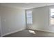 Bright bedroom with neutral carpet and two windows allowing plenty of natural light at 48 Surles Landing Way, Benson, NC 27504