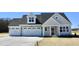 Beautiful two-story home with a three-car garage and stone accents at 48 Surles Landing Way, Benson, NC 27504