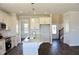 Kitchen with white cabinets, granite countertops, stainless steel appliances, and hardwood floors at 48 Surles Landing Way, Benson, NC 27504