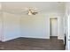Spacious living room with a ceiling fan, hardwood floors, and white trim at 48 Surles Landing Way, Benson, NC 27504