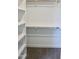 Walk-in closet with shelves and hanging rods, offering plenty of storage space at 48 Surles Landing Way, Benson, NC 27504