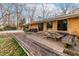 A large brick patio features two grills, and outdoor dining and picnic tables at 5205 Rembert Dr, Raleigh, NC 27612