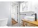Stylish bathroom features a modern sink, unique patterned floor, and a sunlit window, creating a bright, welcoming space at 5205 Rembert Dr, Raleigh, NC 27612
