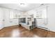 Bright bedroom boasts hardwood floors, lots of natural light, and unique bunk beds with clever storage solutions at 5205 Rembert Dr, Raleigh, NC 27612