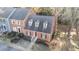 Brick townhouse with gray roof and landscaping, in a residential neighborhood at 768 Weathergreen Dr, Raleigh, NC 27615