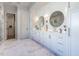 Spa-like bathroom with double vanity and marble flooring at 1307 Mayfair Rd, Raleigh, NC 27608