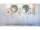Elegant bathroom with double vanity and large mirrors at 1307 Mayfair Rd, Raleigh, NC 27608