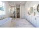 Luxurious bathroom with double vanity, soaking tub, and walk-in shower at 1307 Mayfair Rd, Raleigh, NC 27608