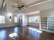 Bright bedroom with hardwood floors, built-in shelves, and a large window at 1307 Mayfair Rd, Raleigh, NC 27608