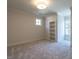 Charming bedroom with built-in shelving and large window at 1307 Mayfair Rd, Raleigh, NC 27608