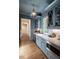 Butler's pantry features gray cabinets, marble countertops, and stainless steel appliances at 1307 Mayfair Rd, Raleigh, NC 27608