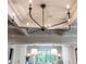 Modern chandelier with multiple lights above kitchen island at 1307 Mayfair Rd, Raleigh, NC 27608
