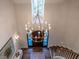 Elegant entryway featuring a grand chandelier and hardwood floors at 1307 Mayfair Rd, Raleigh, NC 27608