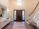 Bright and spacious entryway with hardwood floors, high ceilings, and a grand staircase at 1307 Mayfair Rd, Raleigh, NC 27608