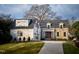 Beautiful brick and stone home with manicured lawn, attached garage, and mature landscaping at 1307 Mayfair Rd, Raleigh, NC 27608