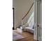 Elegant foyer features staircase, wooden banister and bench with accent pillows at 1307 Mayfair Rd, Raleigh, NC 27608