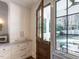 Functional kitchen with custom cabinetry and outdoor views to patio at 1307 Mayfair Rd, Raleigh, NC 27608