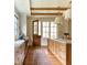 Open kitchen features island, custom cabinetry, and backyard access to exterior at 1307 Mayfair Rd, Raleigh, NC 27608
