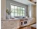 Stylish kitchen with a stainless steel range and natural light from the window at 1307 Mayfair Rd, Raleigh, NC 27608