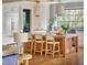 Well-appointed kitchen with island seating, stainless appliances, and designer lighting at 1307 Mayfair Rd, Raleigh, NC 27608