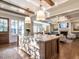 Spacious kitchen boasts an oversized island, stainless steel appliances, and white cabinetry at 1307 Mayfair Rd, Raleigh, NC 27608