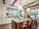 Spacious kitchen with large island, white cabinets, and hardwood floors at 1307 Mayfair Rd, Raleigh, NC 27608