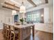 Modern kitchen with a large island and hardwood floors at 1307 Mayfair Rd, Raleigh, NC 27608